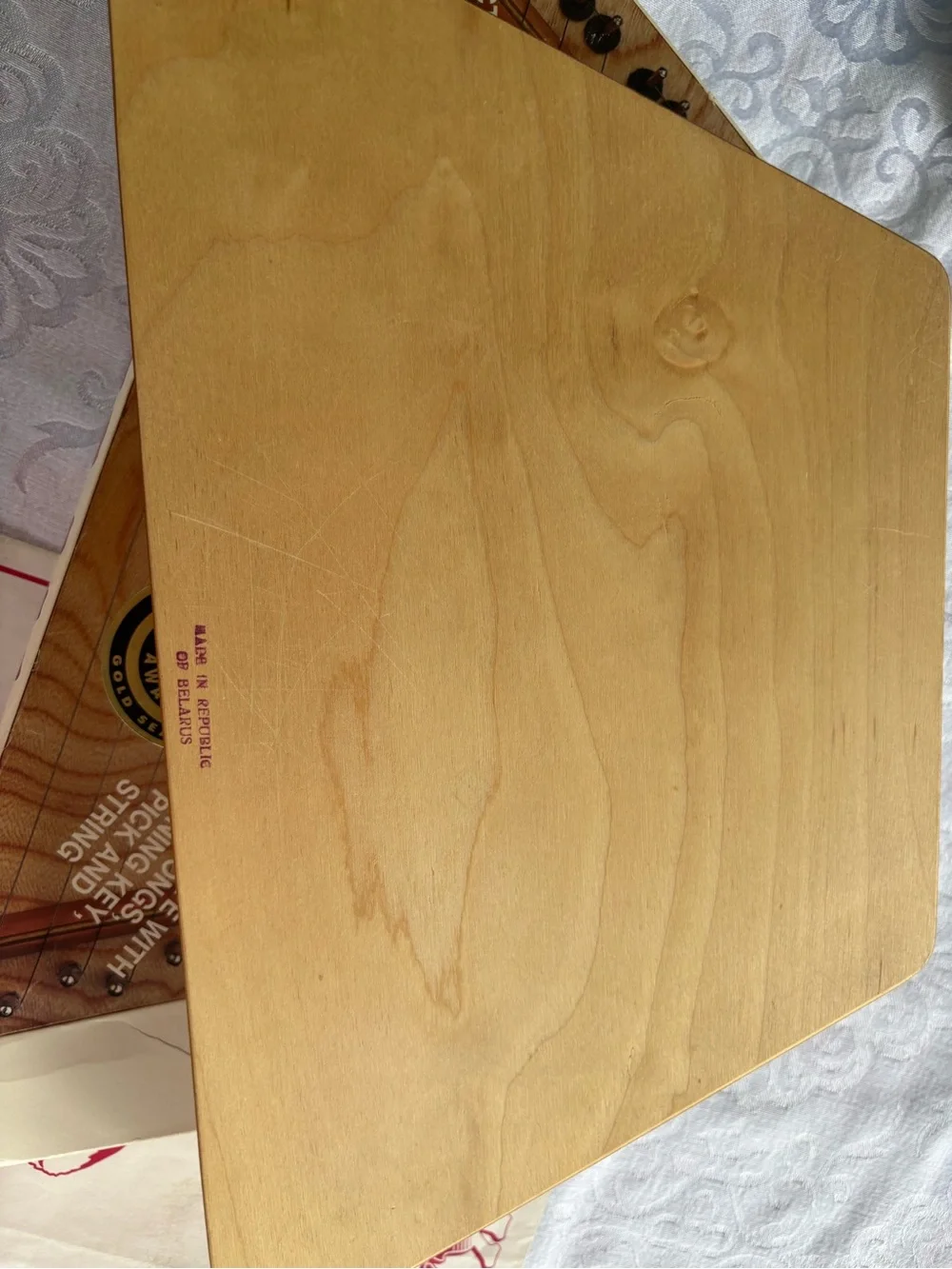 Source Unknown Natural Wood Triangle Music Maker with Red Artwork